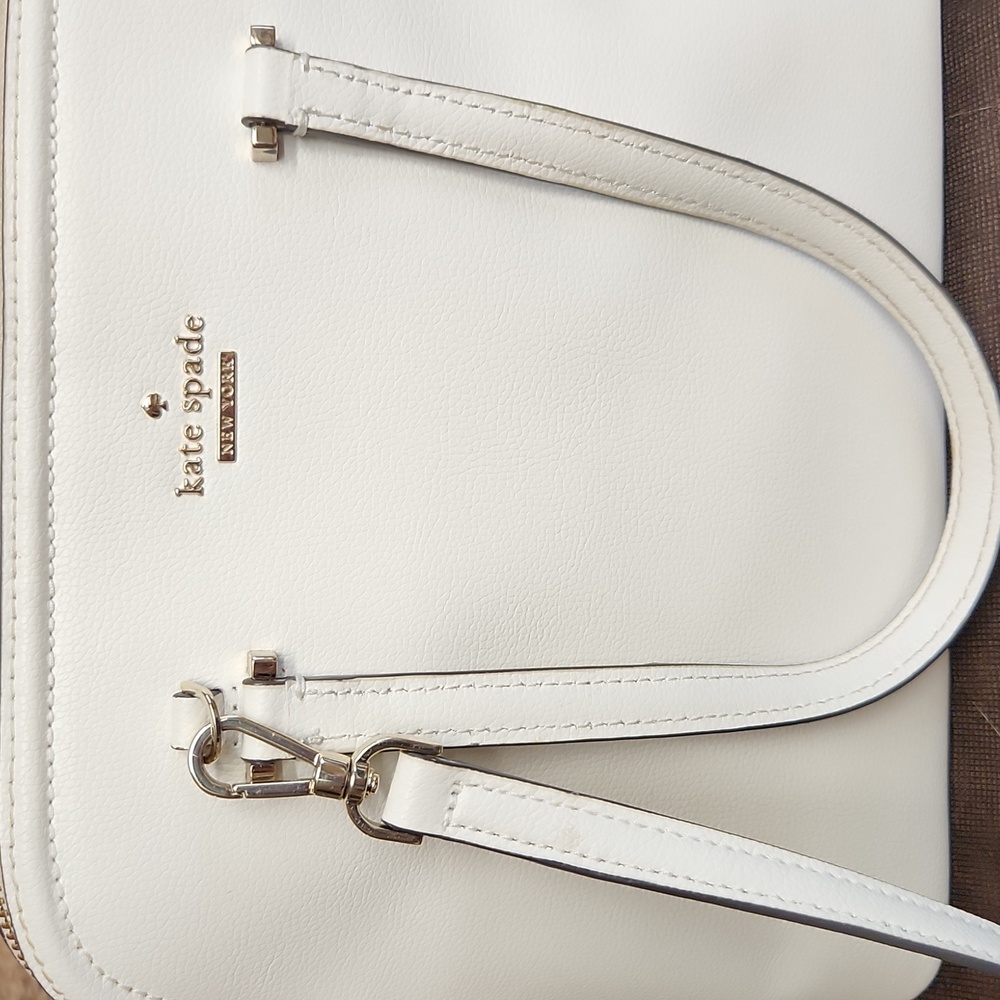 Authentic Kate Spade Handbag with shoulder strap, handles and brown dustbag.